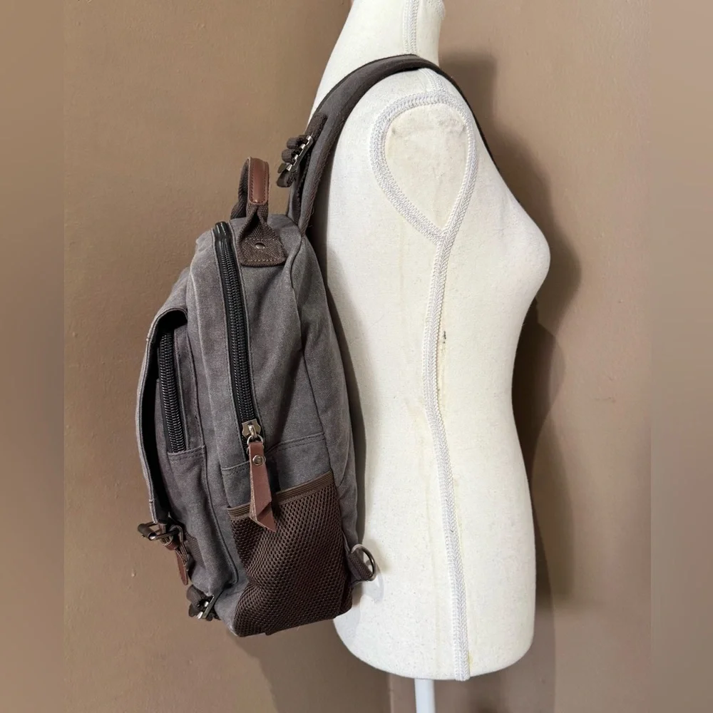 Gray Canvas Crossbody Backpack with Brown Accents Multiple Compartments Durable